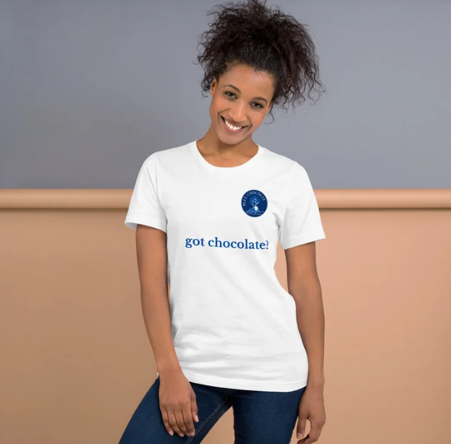 woman wearing t-shirt with Bleu Chocolàt logo and "got chocolate?" across the front