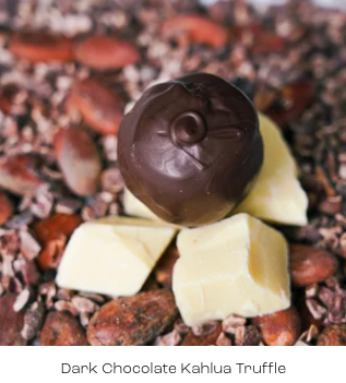 Dark chocolate Kahlua truffle on a bed of cocoa beans