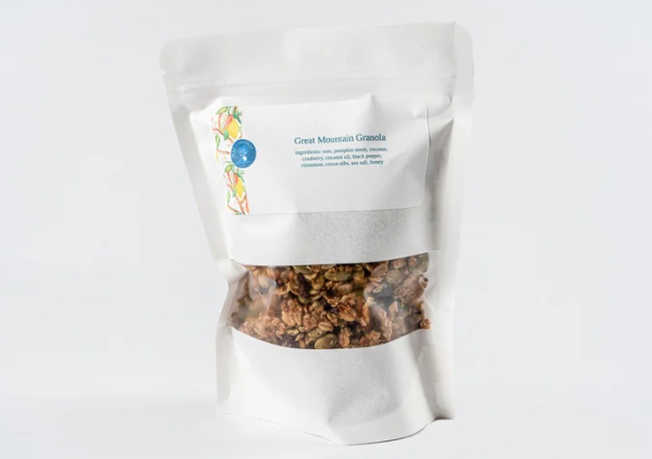 White bag of granola with visible contents on a white background