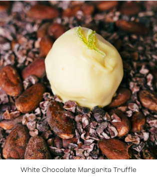White chocolate margarita truffle on a bed of cacao nibs